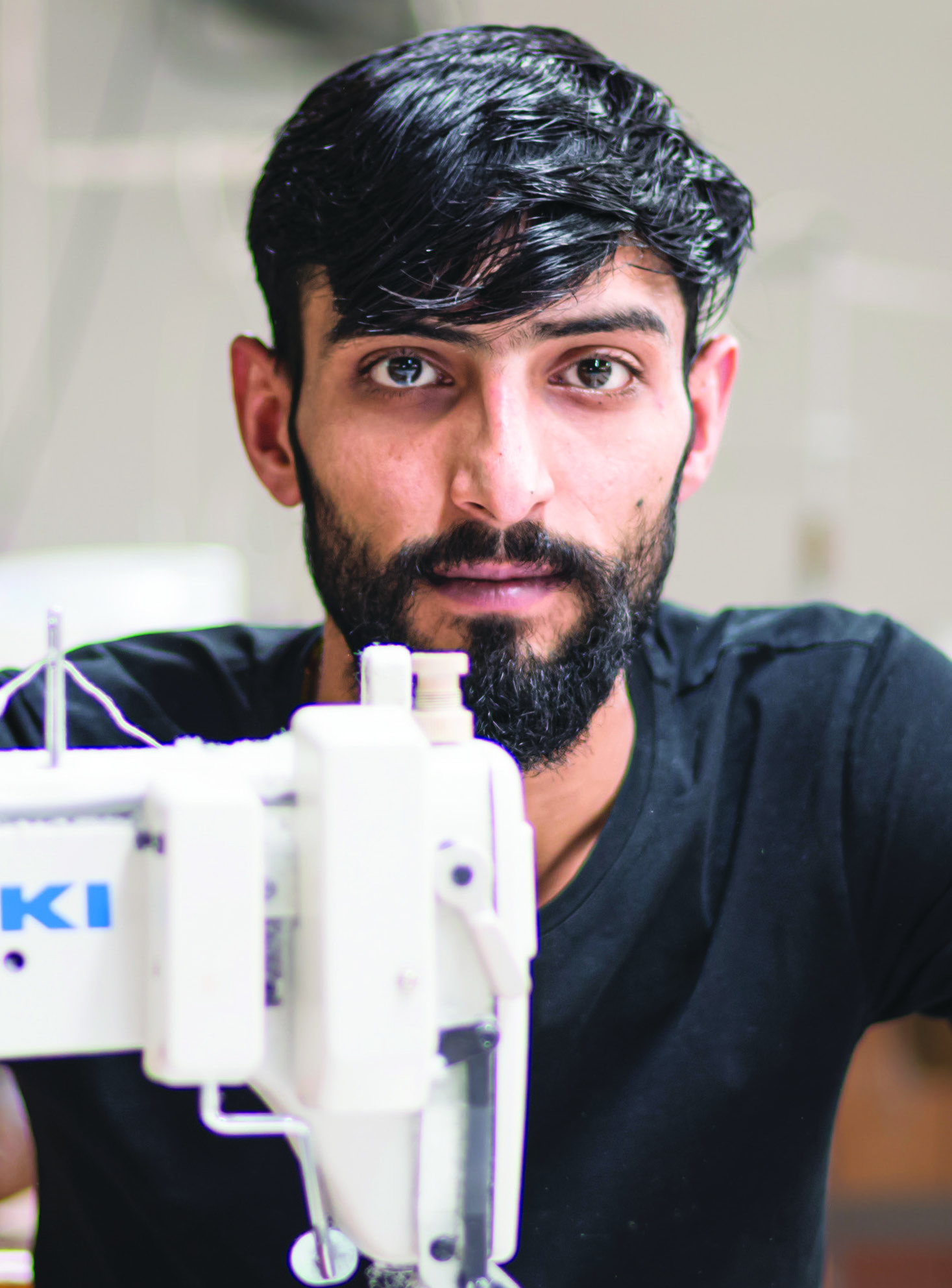 ouvrier devant sa machine à Prato