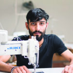 ouvrier devant sa machine à Prato