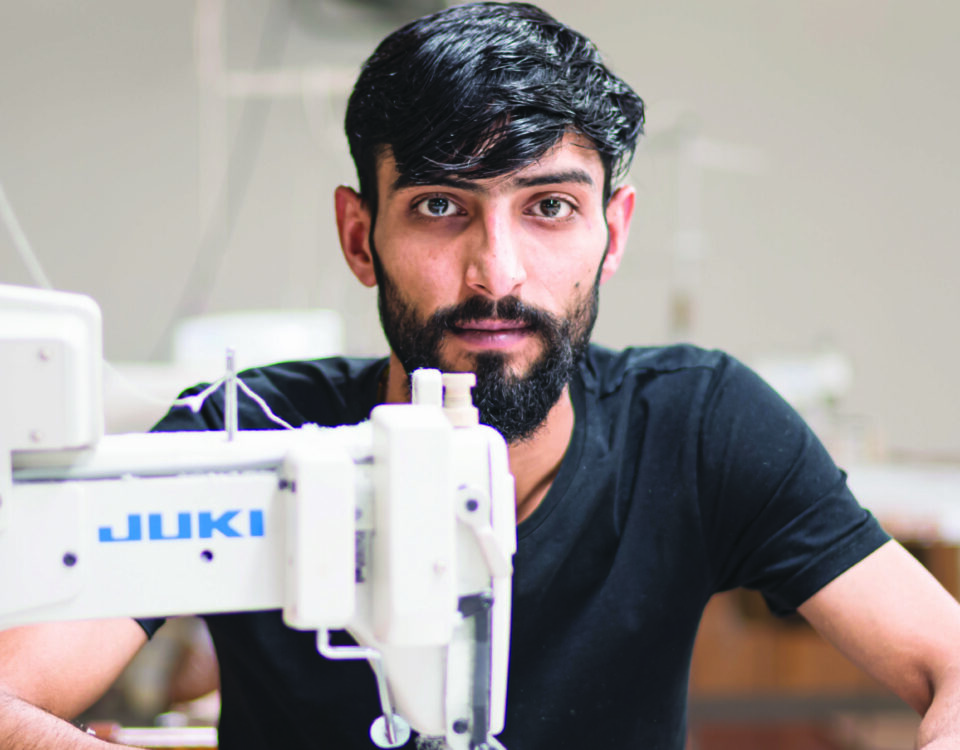 ouvrier devant sa machine à Prato