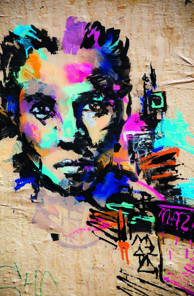 Portrait of a woman. Poster stuck to a wall.